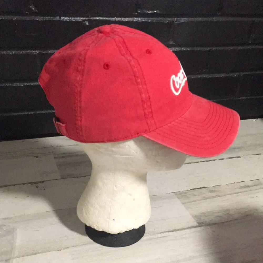 Coca-Cola red adjustable back ball cap with gold tone buckle and white emblem